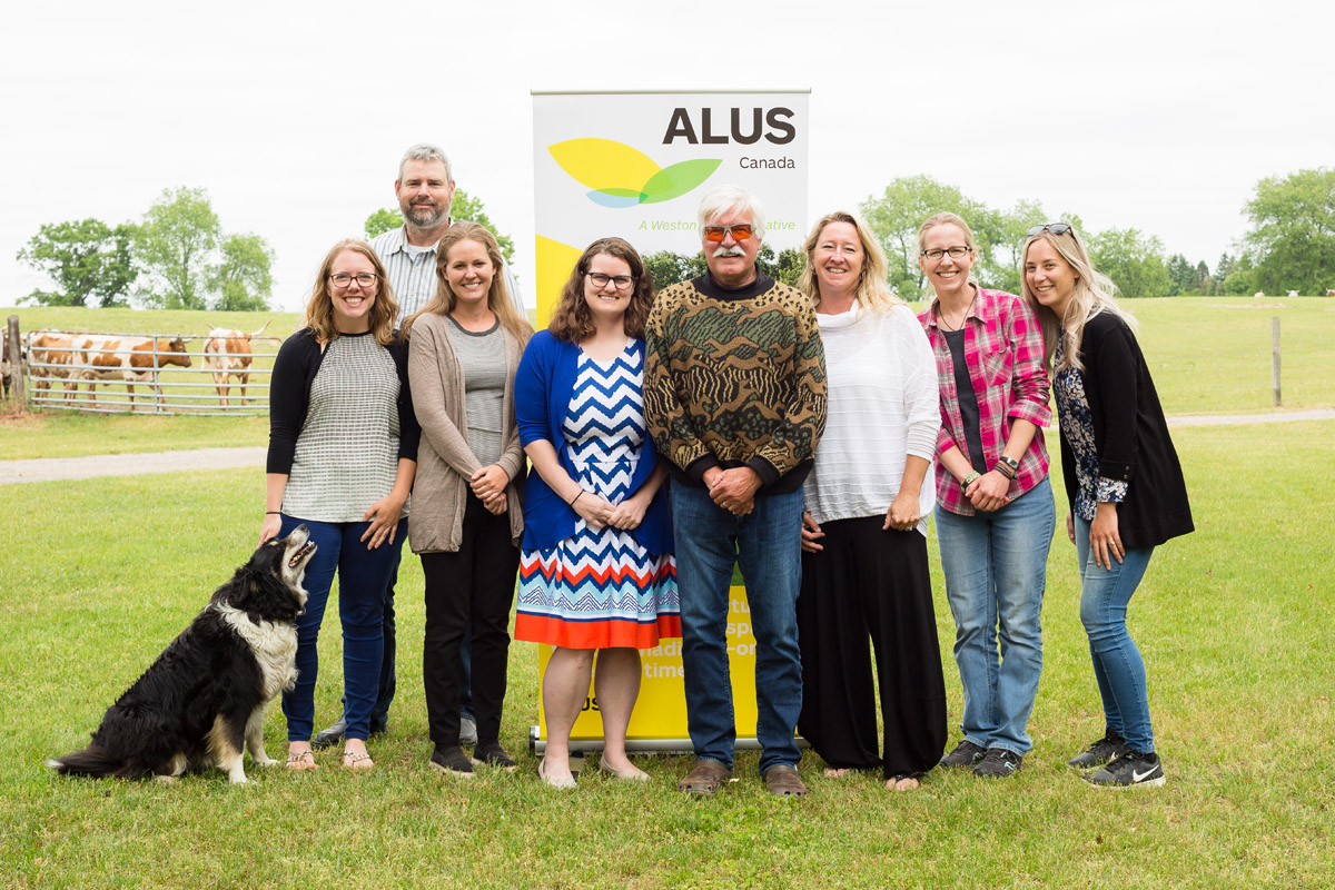 One of the wonderful things Dave Reid has done for ALUS is to serve as a mentor to its younger staff. Here, he poses with seven of Ontario’s ALUS Program Coordinators. From L to R: Hillary Heard (ALUS Middlesex), Henry Bakker (ALUS Peterborough), Alyssa Cousineau (ALUS Elgin), Casey Whitelock (formerly ALUS Norfolk, now ALUS Canada Eastern Hub Manager), Dave Reid (retired ALUS Canada Director of Research), Lindsay Buchanan (ALUS Lambton), Cynthia Tosswill (ALUS Norfolk), Stephanie Drayer (ALUS Norfolk). (Photo: Splash Photography)