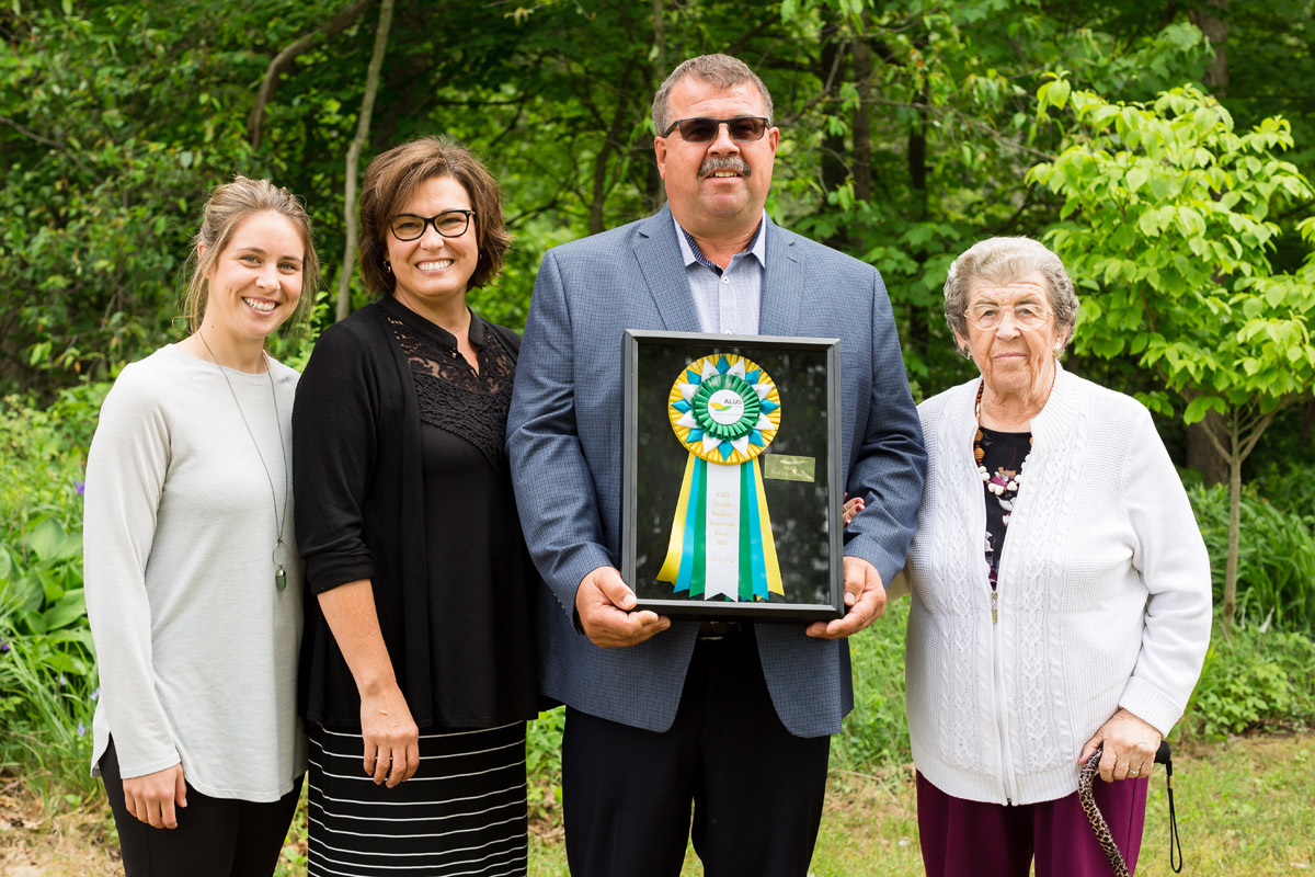 The recipient of the 2018 ALUS Canada Producer Innovation Award is Joe Csoff of ALUS Norfolk, flanked here by his daughter Lindsay Konietzny (on left), his wife Karen Csoff, and his mother Maria Csoff (on right). (Photo: Splash Photography)