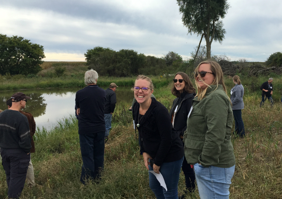ALUS Middlesex Program Coordinator Hillary Heard (centre) and Ontario Nature staffers Sarah Hedges and Emma Horrigan enjoy a light moment while touring an wetland and sediment basin at an ALUS Elgin project during ALUS Canada’s Eastern Hub workshop. 