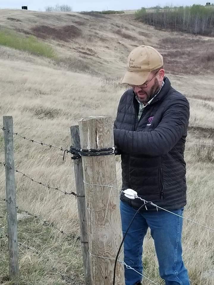 Sean McGrath working on a fence.