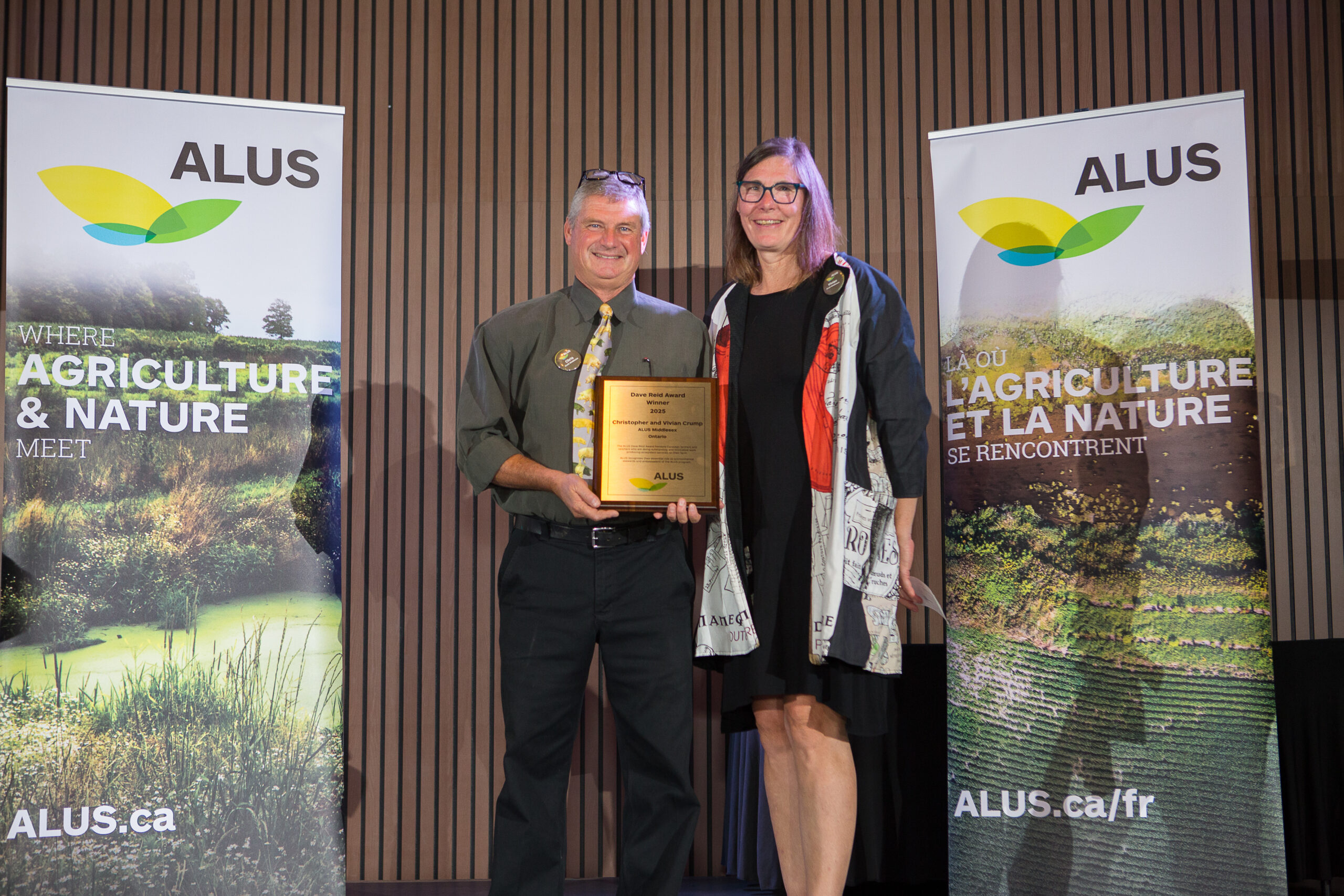 Chris and Vivian Crump accepting 2025 Dave Reid Award