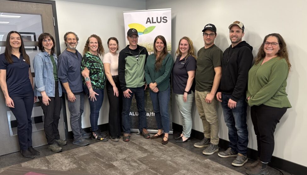 ALUS Assiniboine West participant, Sean Smith, manages a solar watering system, which prevents fouling of the wetland in the foreground and still provides his herd with fresh water.